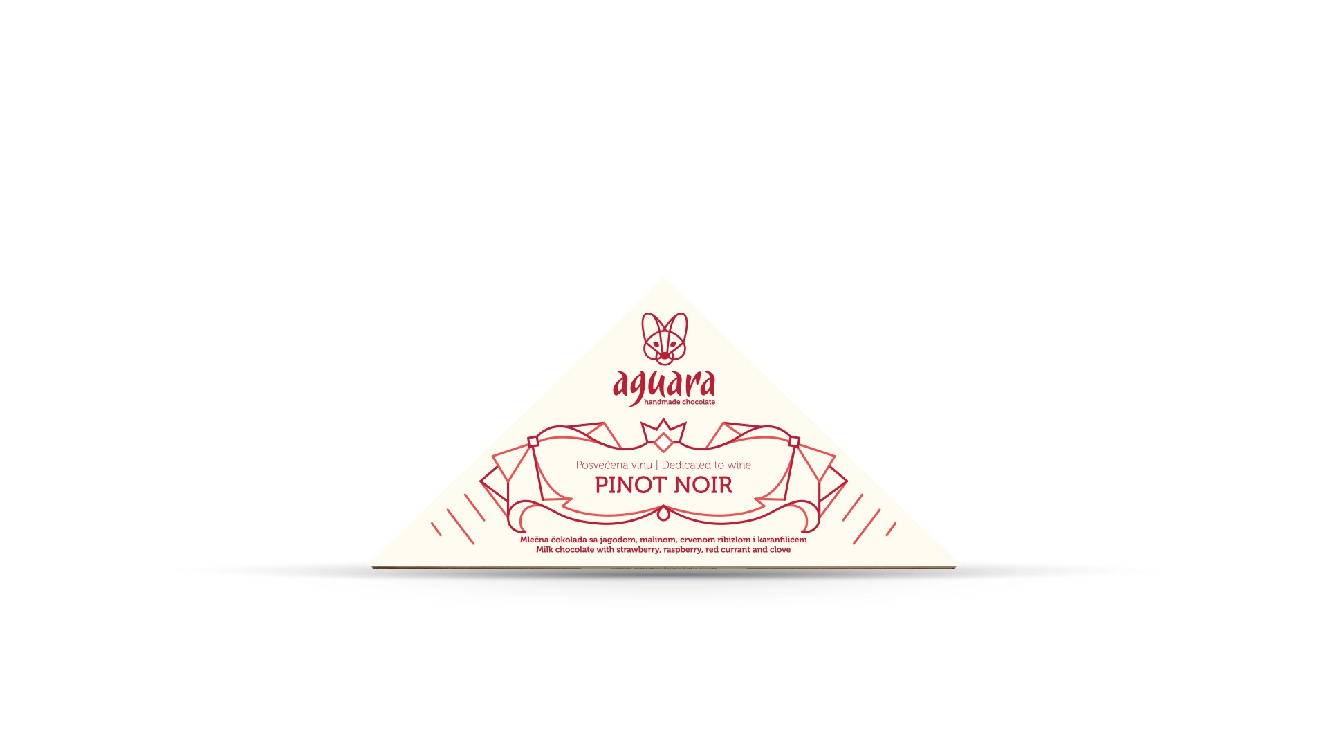 Trouglasta čokolada čokoladeposvećene vinu Pino noar. Na ambalaži se nalaze linijski elementi koji predstavljaju elemente srpske tradicije.
