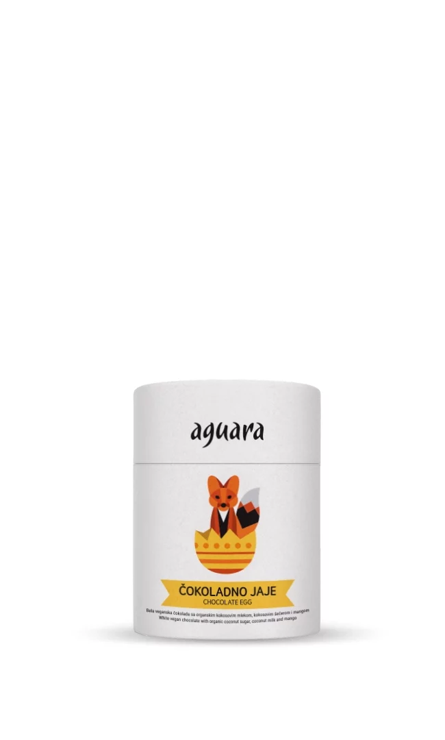 Tuba u kojoj se nalazi vegansko jaje od bele čokolade sa mangom. Na etiketi se nalazi aguara koja izlazi iz jajeta.