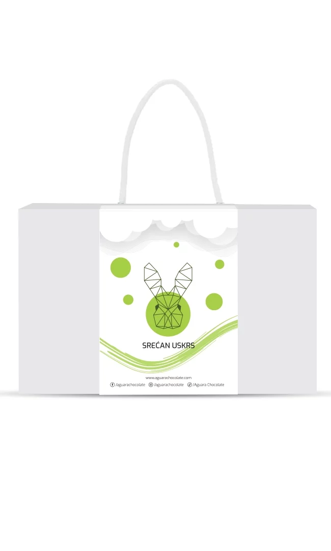 Srećan Uskrs poklon pakovanje Aguara chocolate. Bela kutija sa trakom koja ima kanap umesto drške. Na traci se nalazi linijski iscrtan zeka. Iznad njega se nalaze oblaci a ispod njega zakrivljene zelene linije. Oko zeke se nalaze zeleni krugovi .